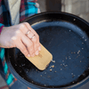 bamboo pot scraper on camp cooking pan