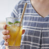 A glass of lemonade also holds a Precision Bamboo Straw, ready for sipping.