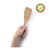 A person holds a bamboo spatula in their left hand. An icon in the upper right corner shows a left hand with a thumbs up, and the text highlight this is a left handed utensil.