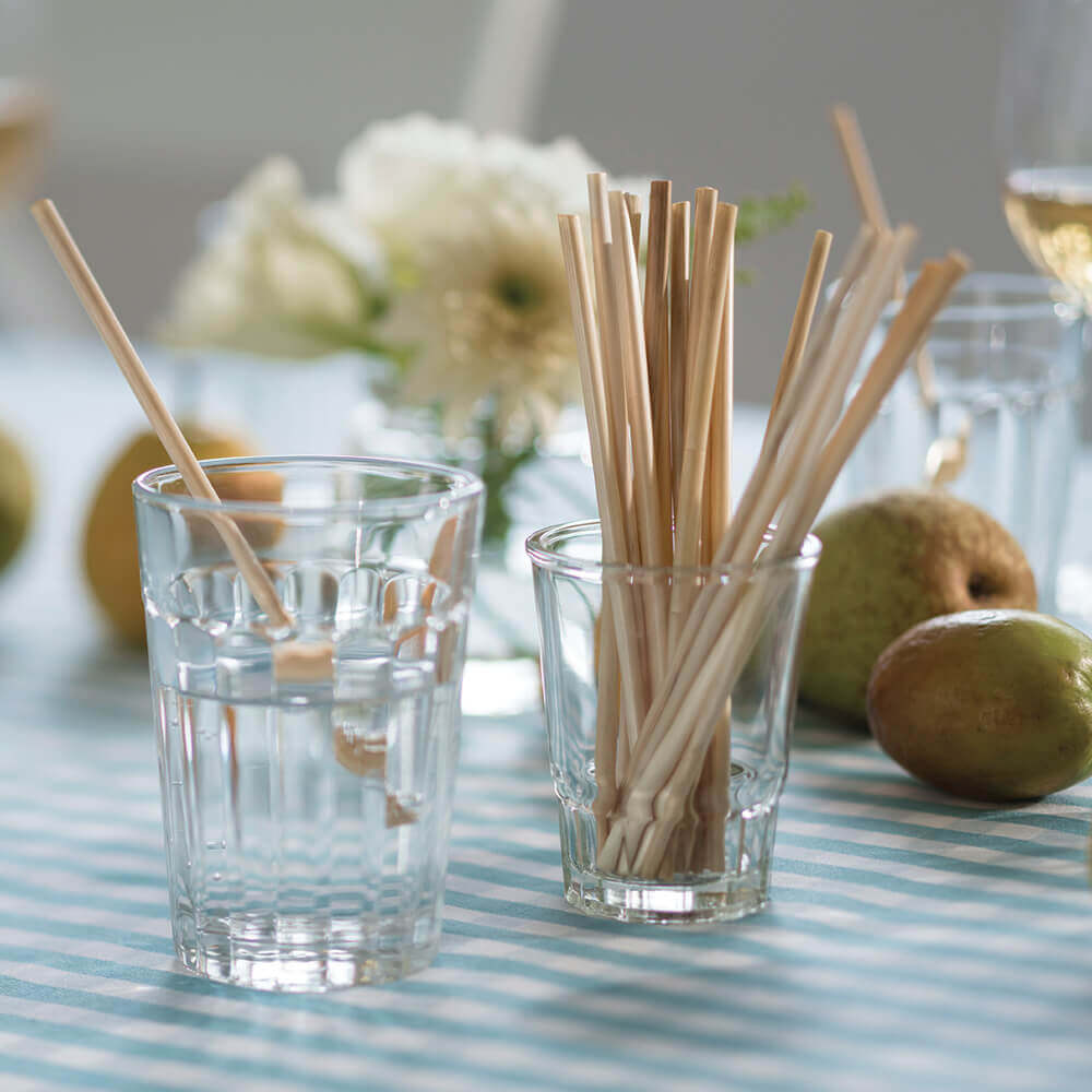 8-inch Biodegradable wheat straws are displayed in a drinking glass.