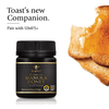 Premium Manuka Honey from BeeNZ is spread on a piece of toast.