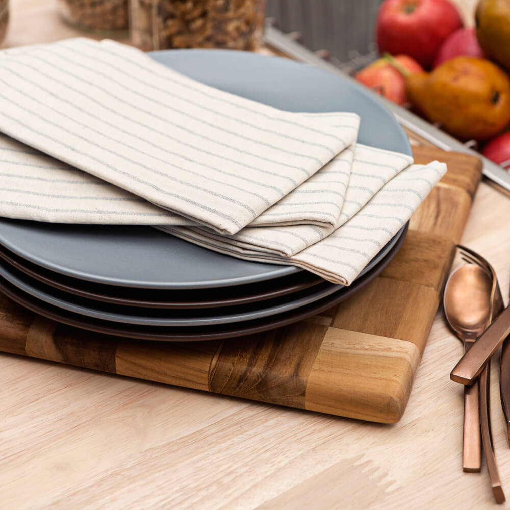 MEEMA striped dinner napkins accent well with blue and charcoal plates.